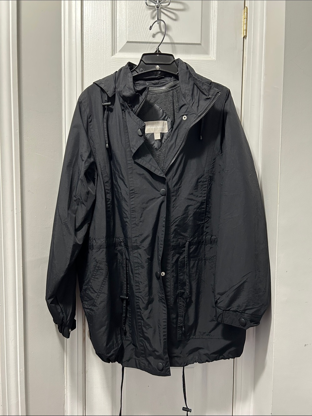 Woman Within Black Hooded Trench Coat
